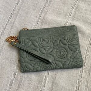 Deux Lux quilted wristlet with gold embellishments.